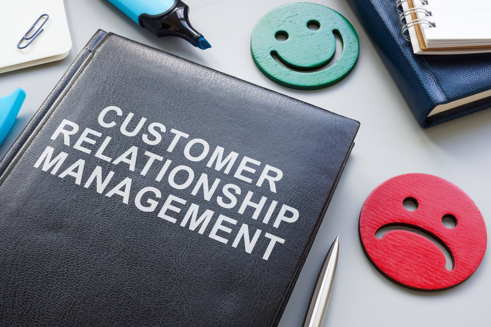 Customer relationship management book and big smiles.