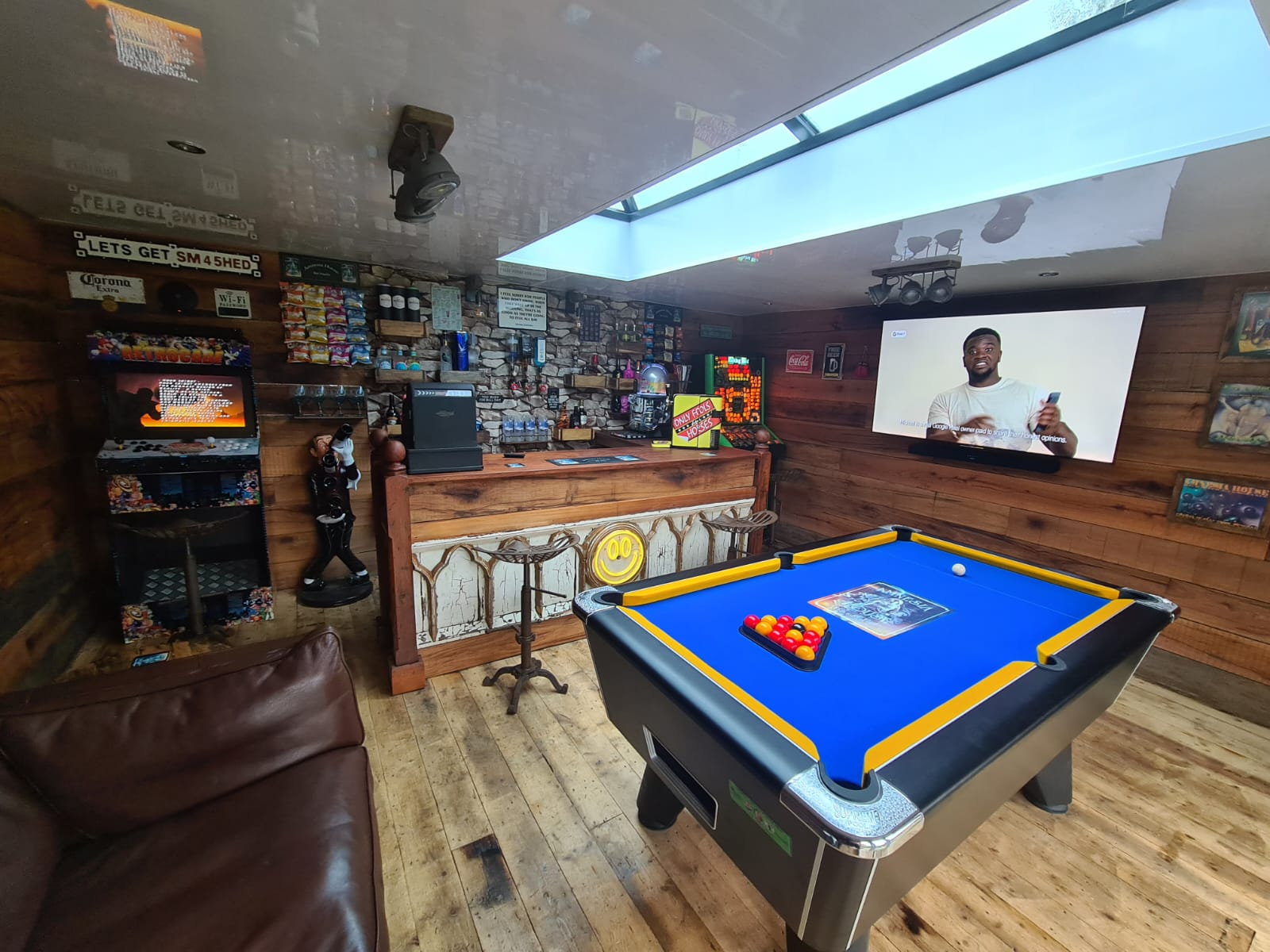 Contemporary living room interior featuring neutral beige palette, built-in arched shelves, and minimalist furniture design