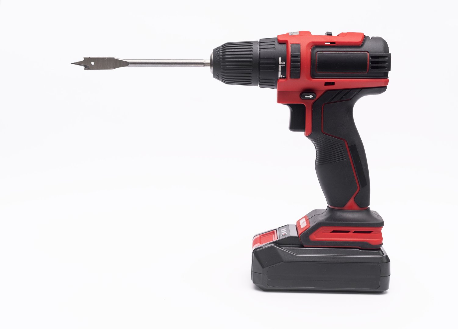 an electric cordless screwdriver with a wood drill. isolated on a white background