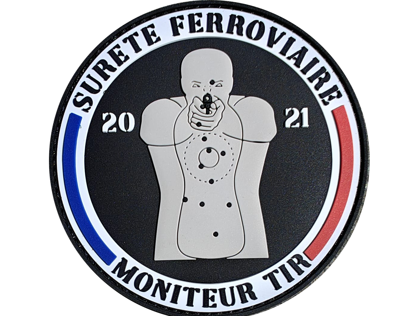 Emblem with a target silhouette, text reads Surete Ferroviaire, Moniteur Tir, 2021, in a circular design with French colors.