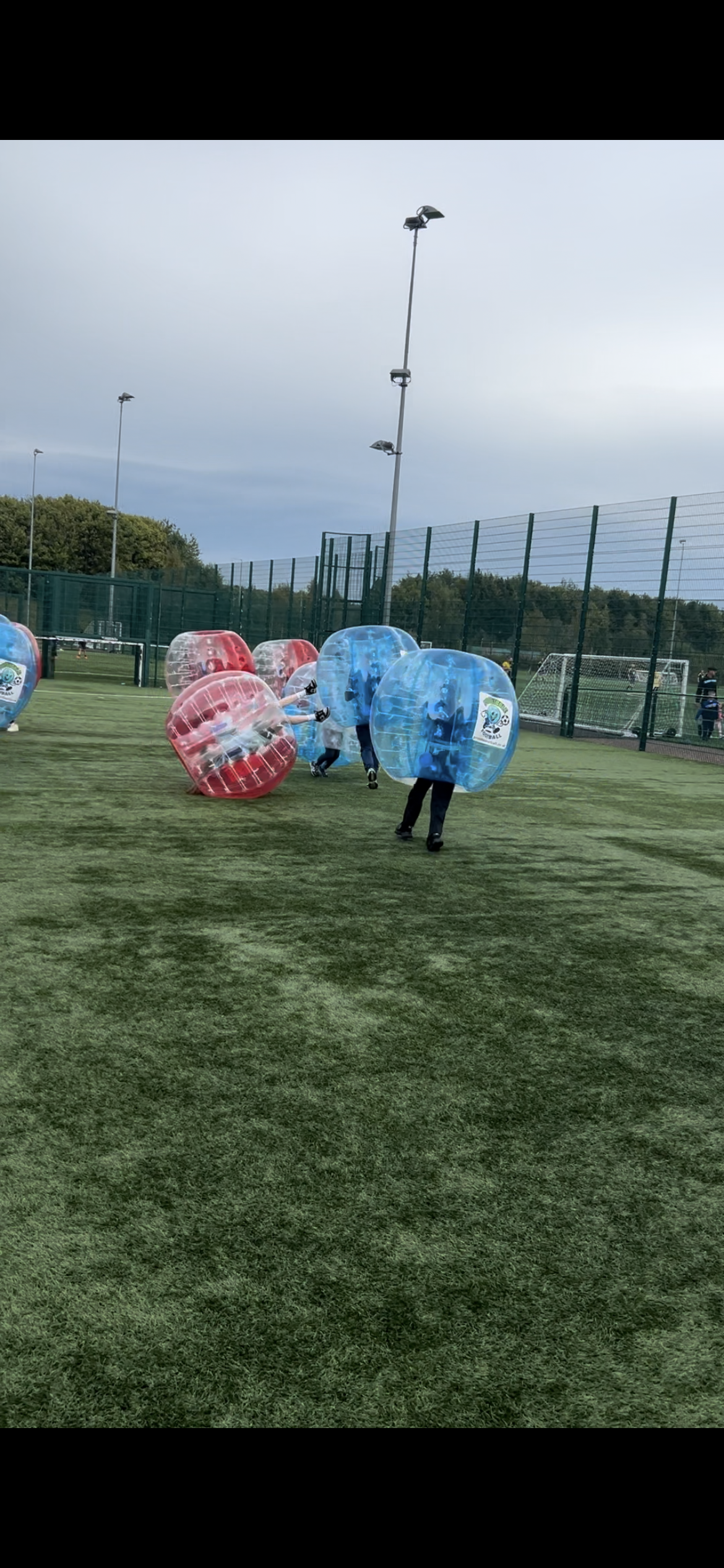 Children playing bubble football