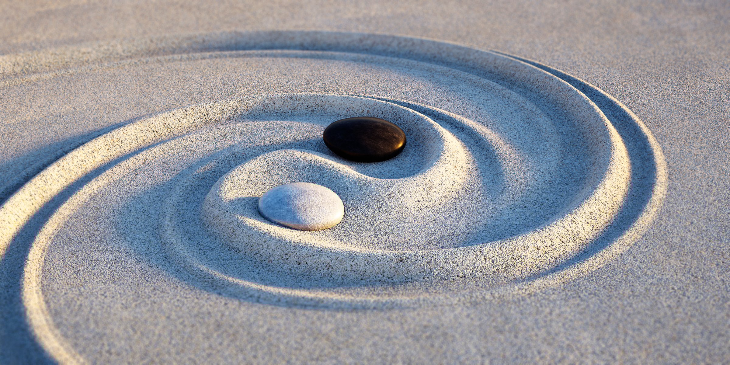 Yin Yang symbol. Motive made of stones and lines in the sand at sunset - 3D illustration