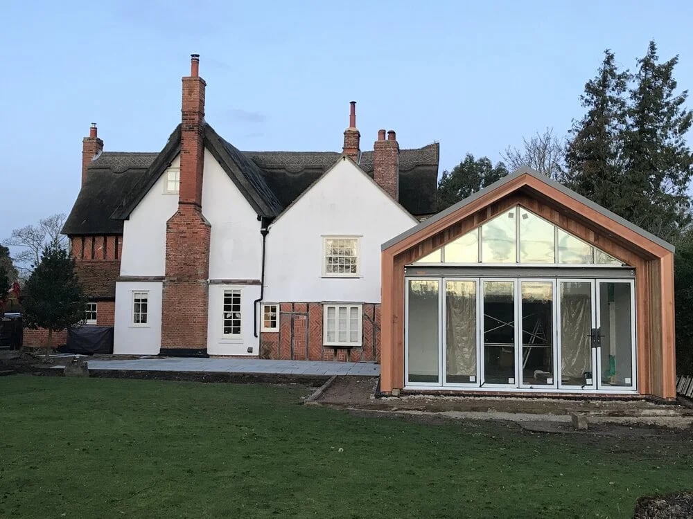 Bouchiers Lodge Grade II listed building extension with cedar cladding and zinc roof