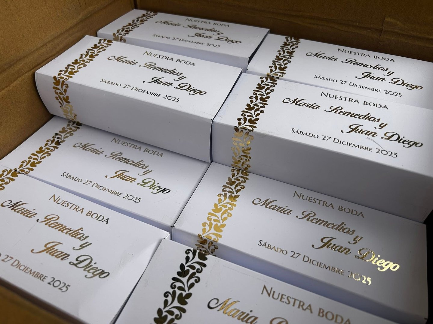 A selection of four baseball caps is neatly arranged in a row, showcasing the colors red, white, and black.