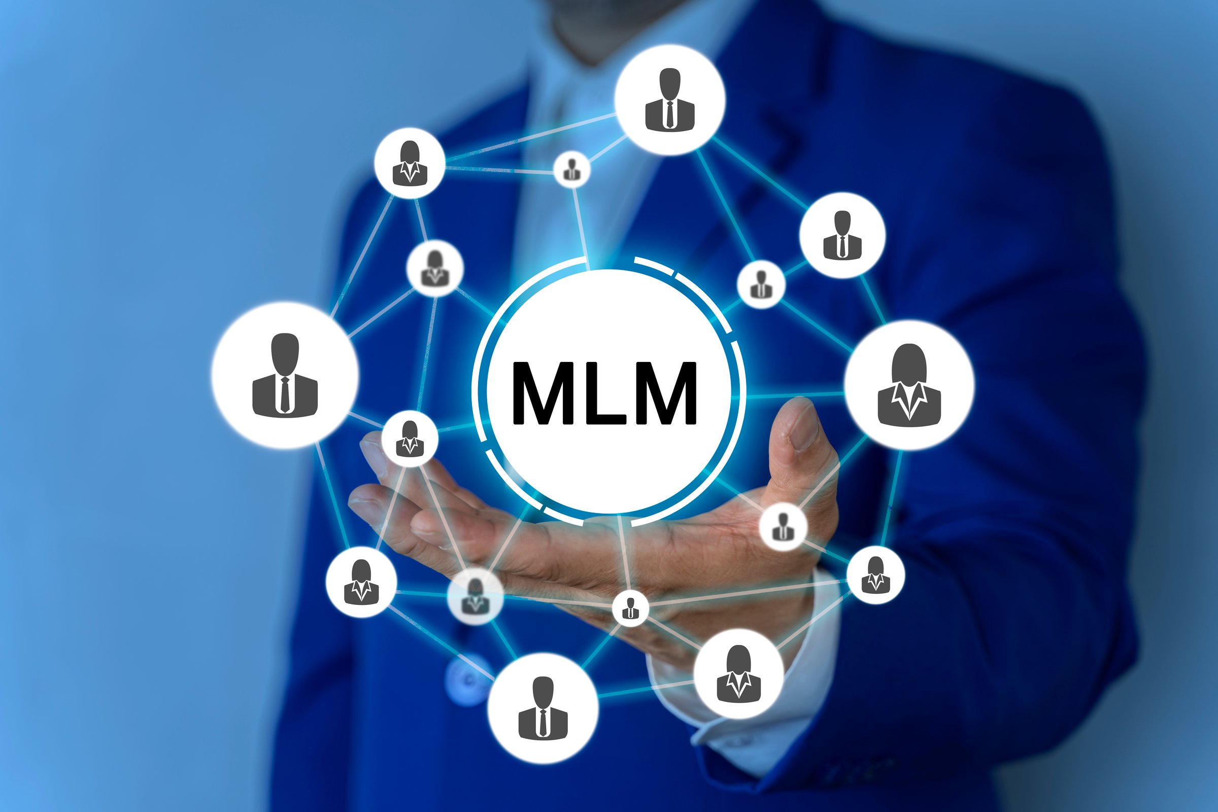 MLM, Man Working on Holographic Interface, Visual Screen. HR, human resource management concept on the hands of a businessman, corporate executive