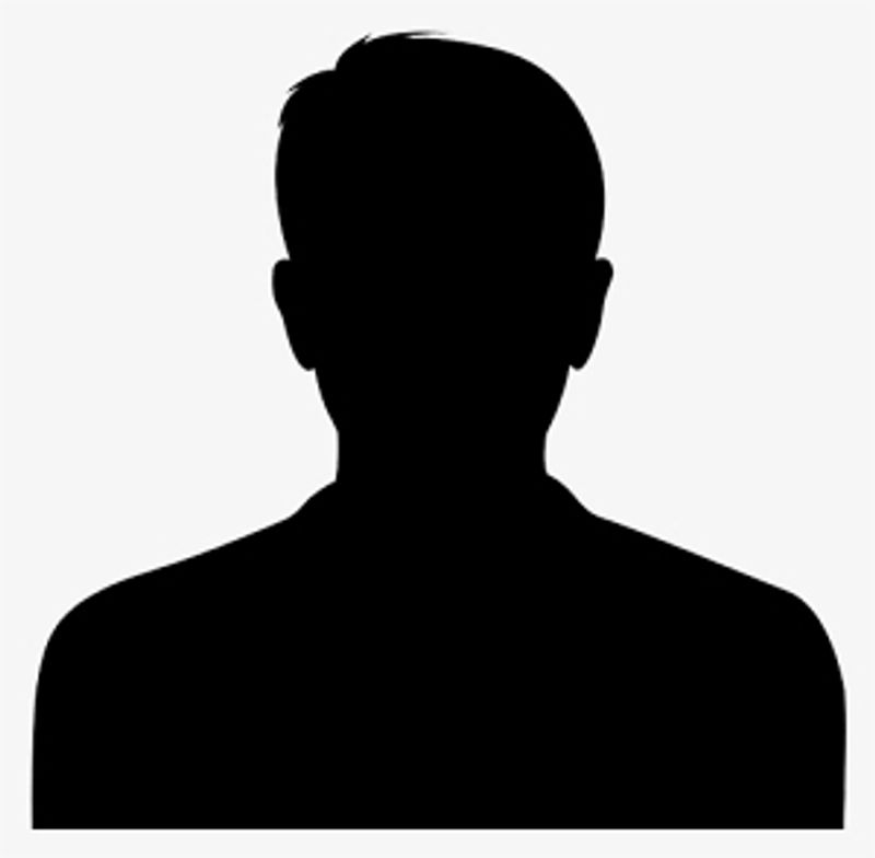 Silhouette of a person with short hair against a plain background.