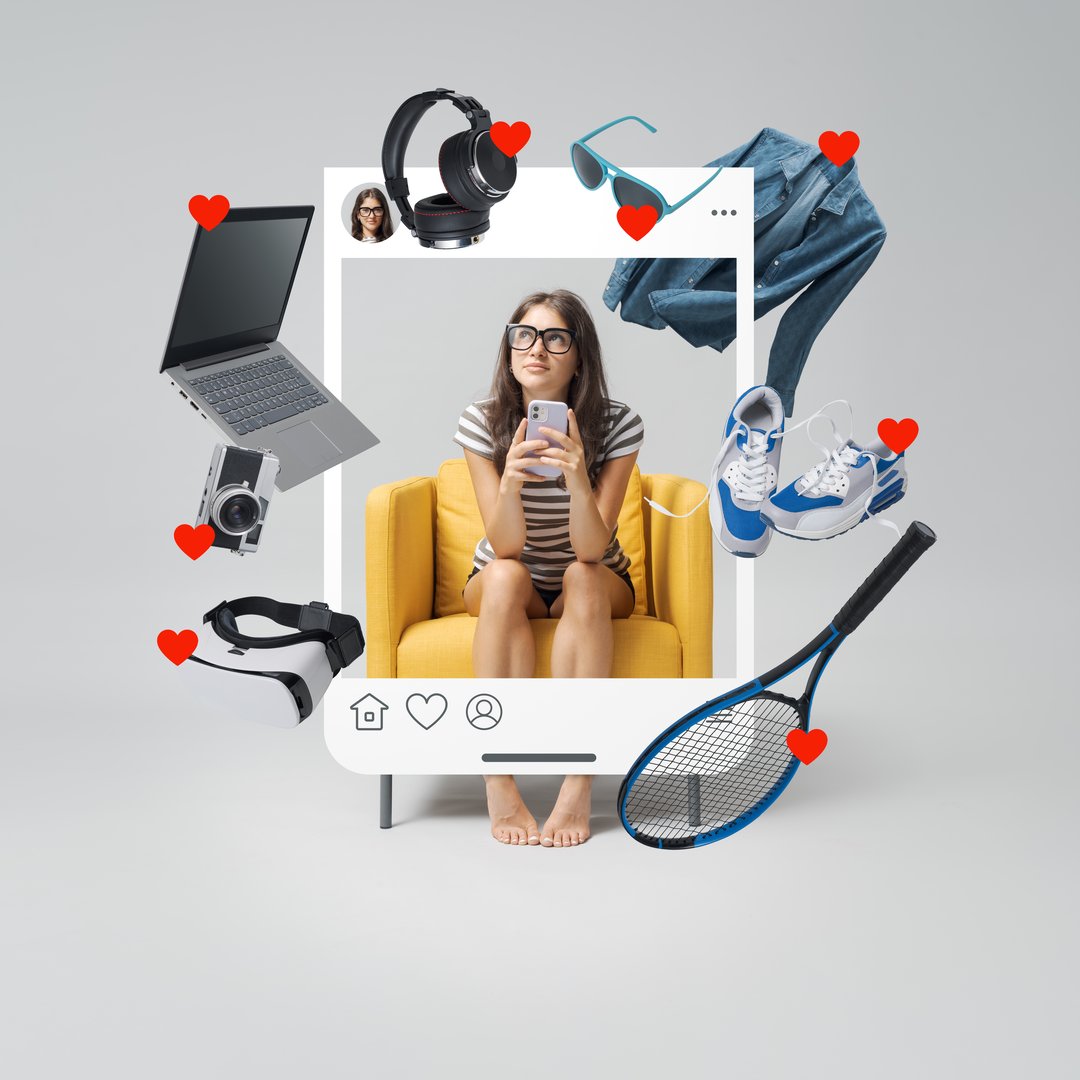 Happy young woman doing online shopping on her smartphone, she is sitting on an armchair inside a social media post and looking at the products on sale