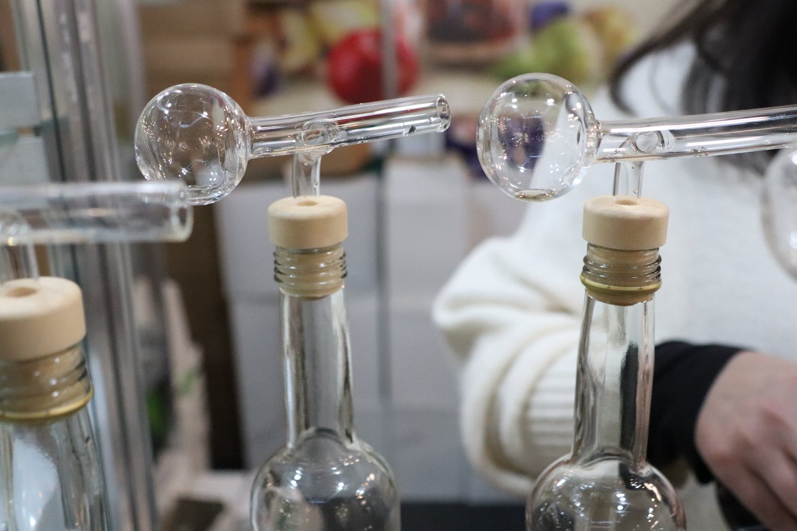 Glass Bottles Dispenser for Alcoholic Beverages at Food Exhibition. High quality photo