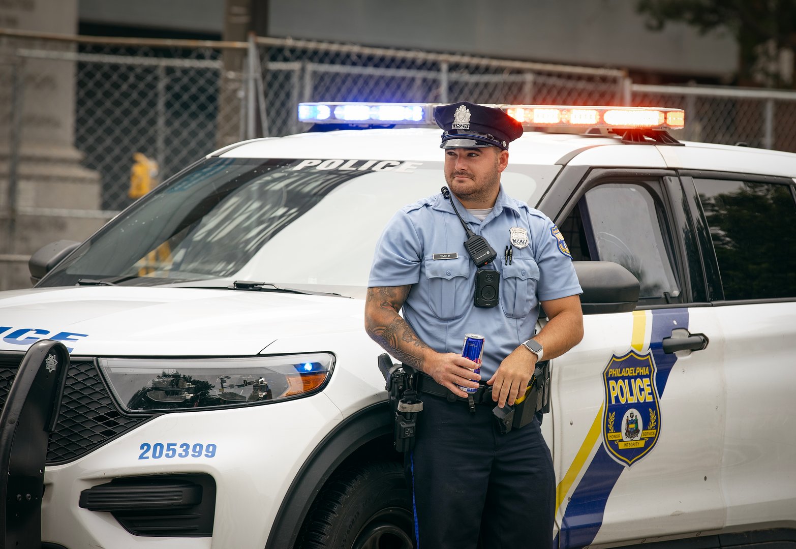 A Philadelphia PD police officer in front of a squad car in Philadelphia, Pennsylvania, U.S., July 2, 2025