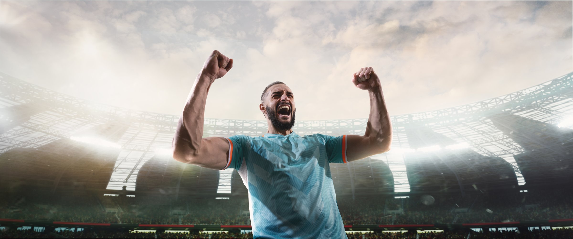 Bearded football player raising fists in triumph in modern 3D stadium. Concept of summer sport, emotional win, athlete pride, fan engagement, football campaign visuals.
