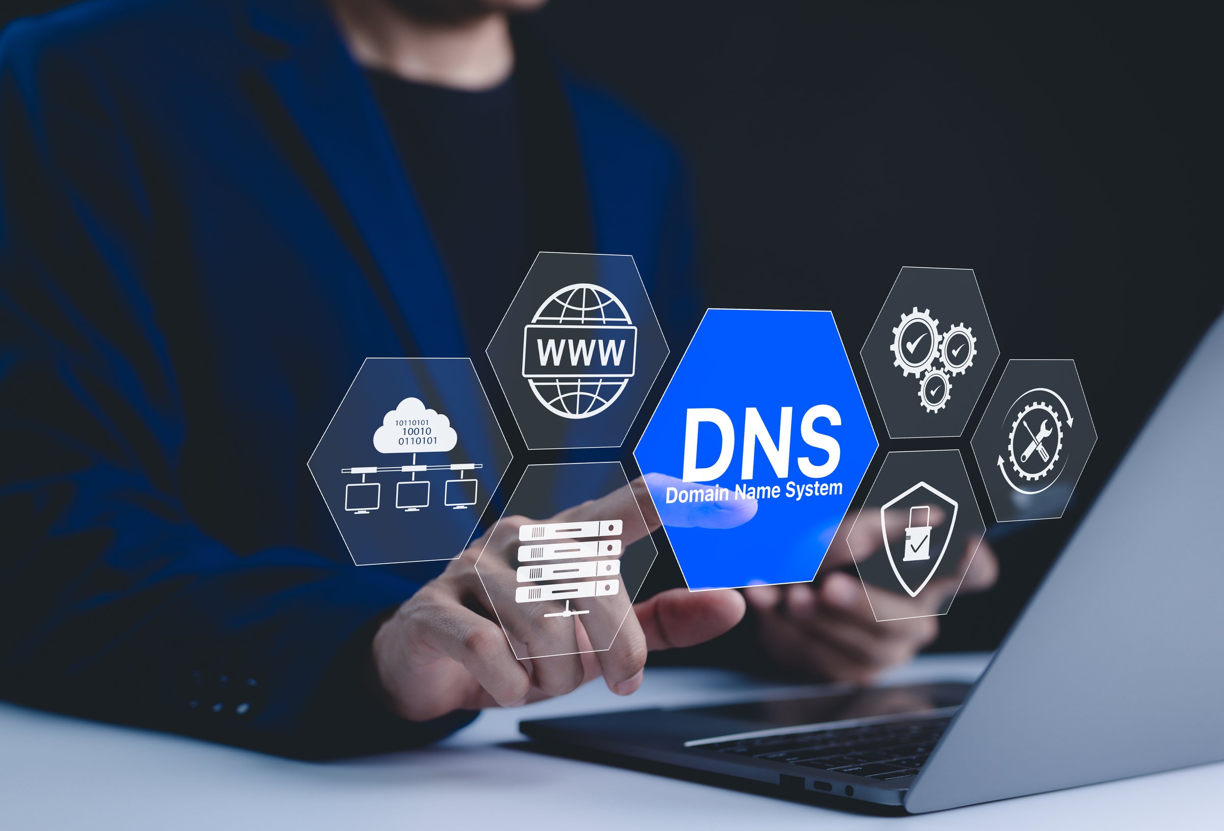 DNS domain name system and web server network system concept. A person uses a laptop, with DNS and web network icons representing domain name system, cybersecurity, and global internet connections.