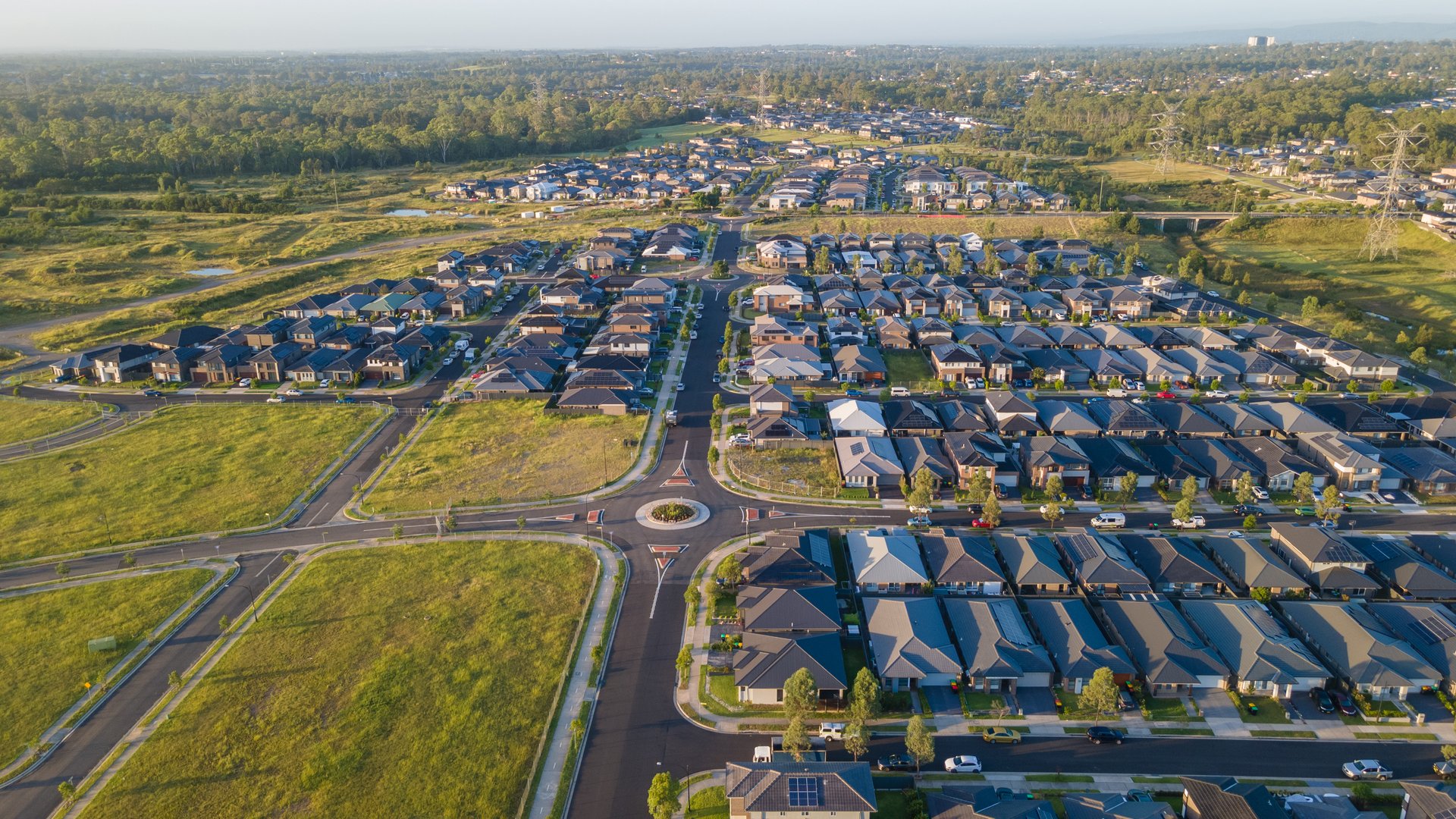 Aerial drone view of Jordan Springs East, known as the sinking suburb, in western Sydney, NSW Australia on a sunny morning in February 2024
