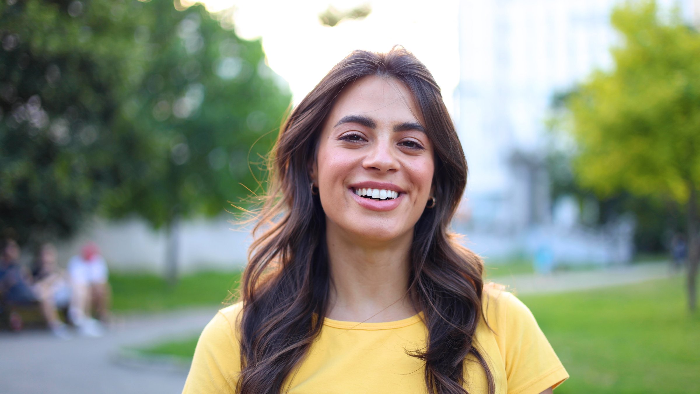 Portrait of a beautiful, young woman enjoying at the city park