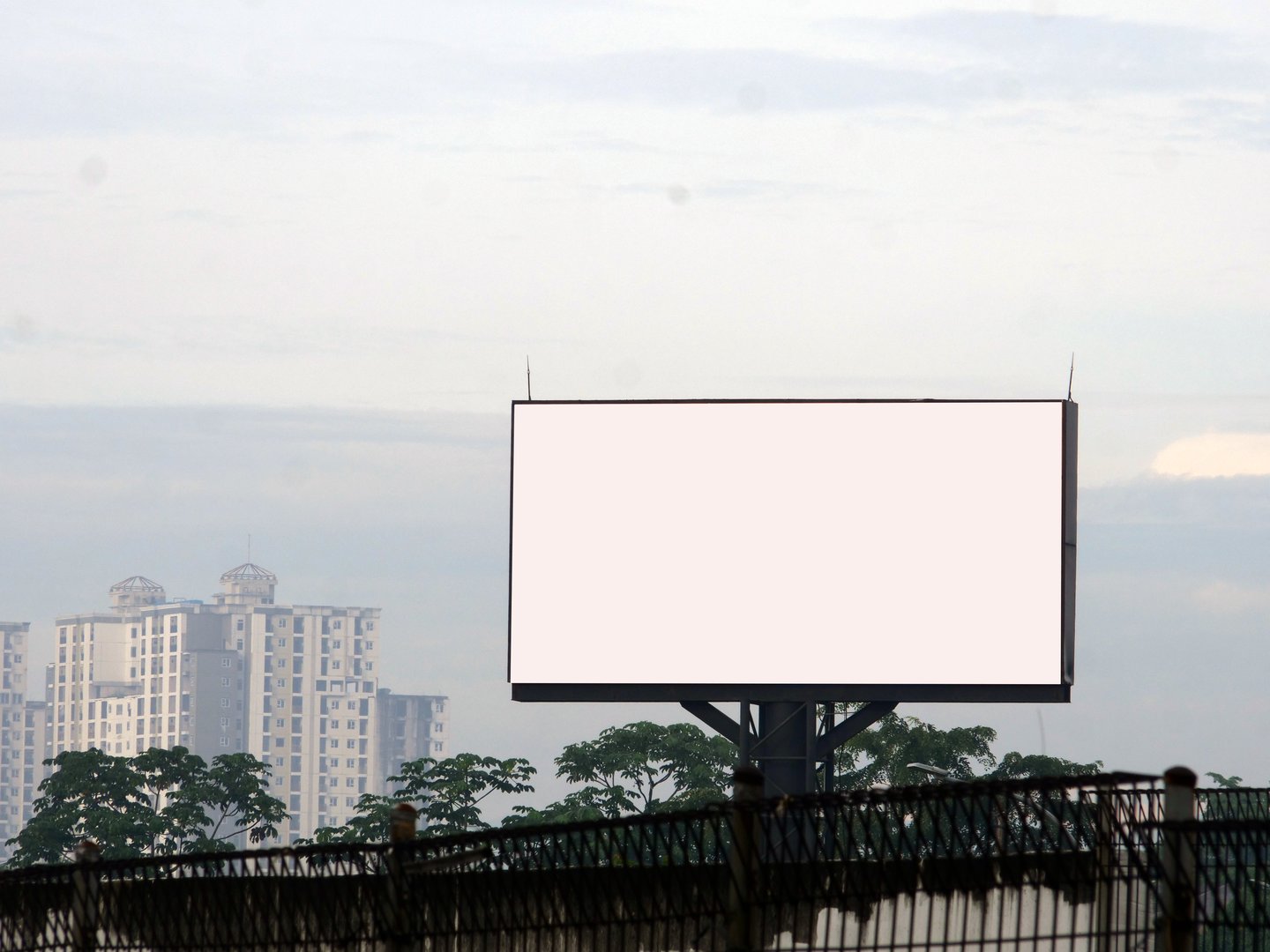 Blank Billboard in Urban Setting with Cityscape Background. blank background