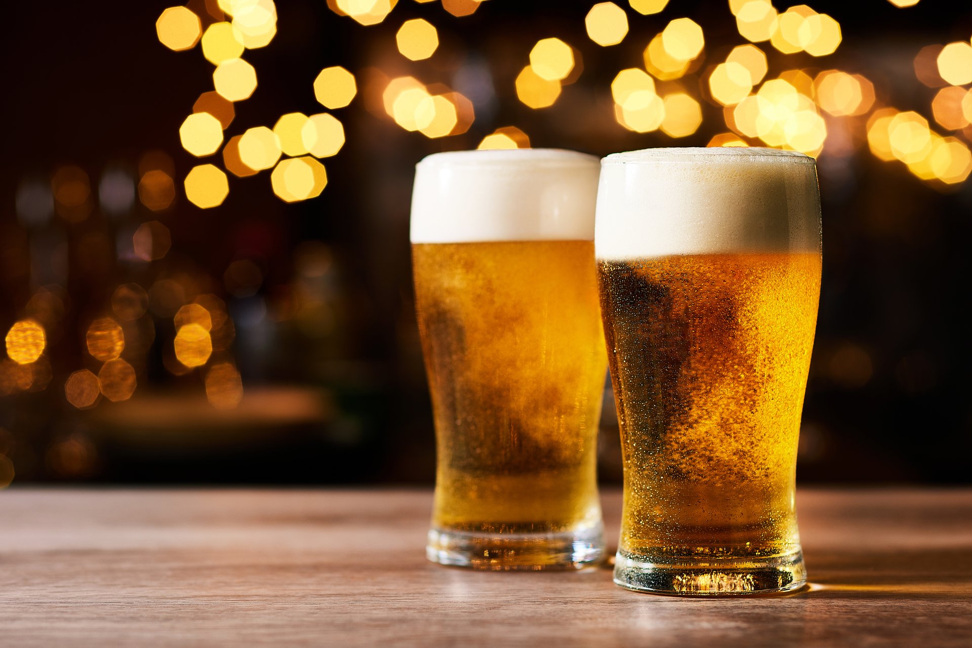 Two beer mugs on table in Irish pub