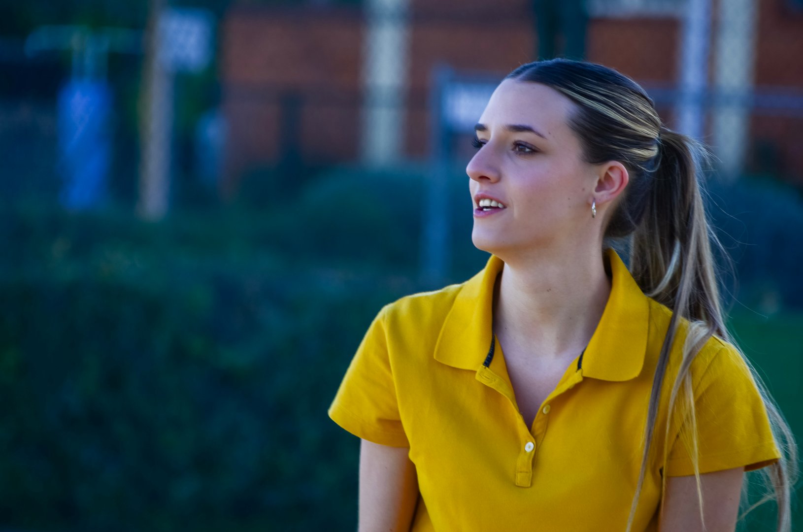 Female tennis player looking intensely at a tennis match