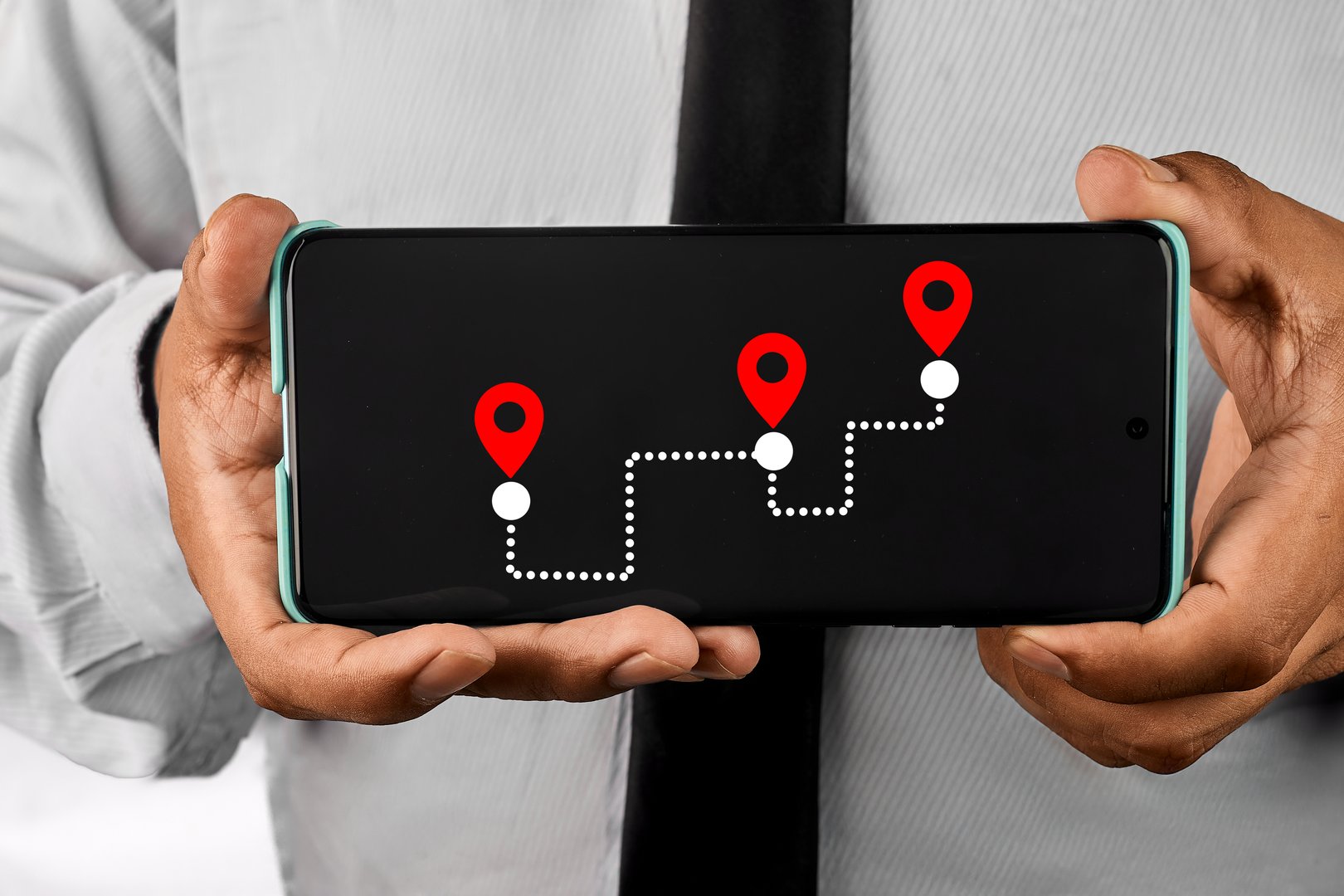 A smartphone screen displaying a navigation route with multiple location pins.The image represents logistics planning, route optimization and strategic digital navigation.