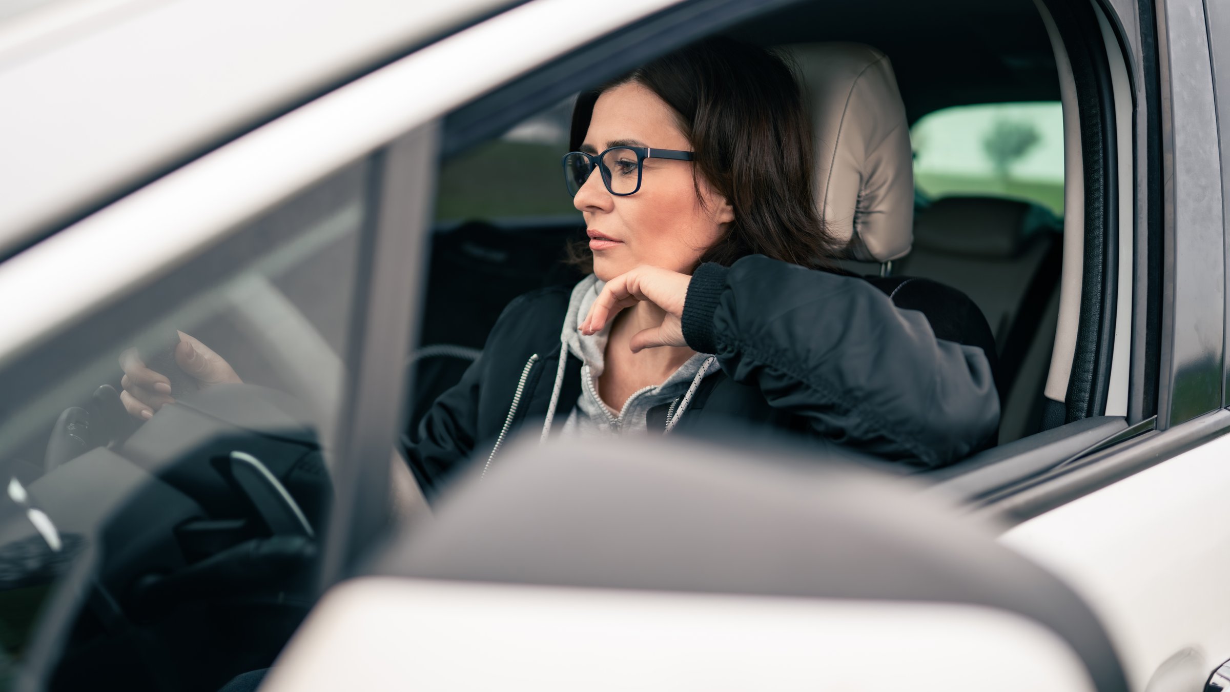 Female Driver In A Car Before A Road Trip
