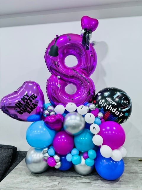 Themed balloon bouquet with one number
