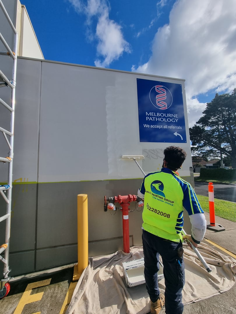 Quality Painting Group retail store makeover project - June 2024 showing detailed commercial painting work in progress