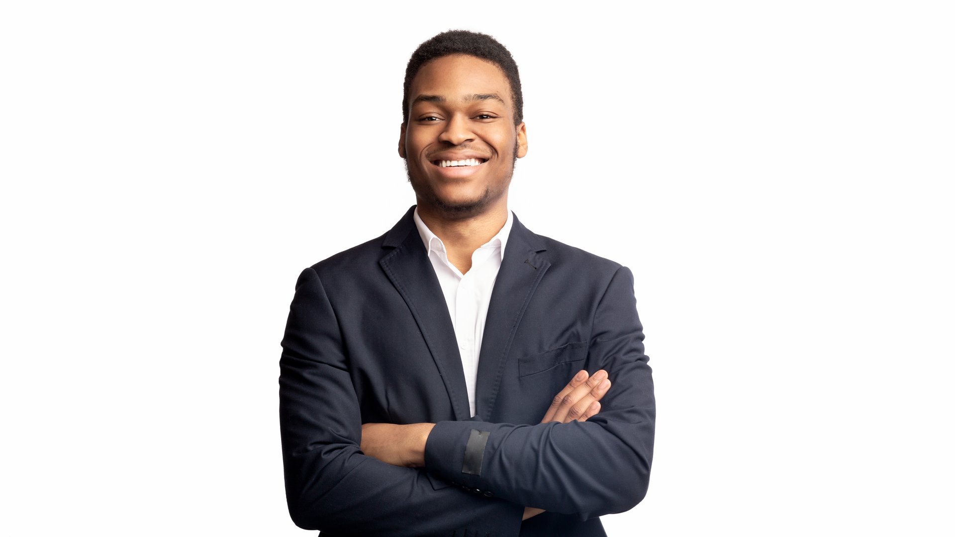 Millennial Entrepreneur. Confident afro man crossing arms, standing over white studio background. Panorama, free space