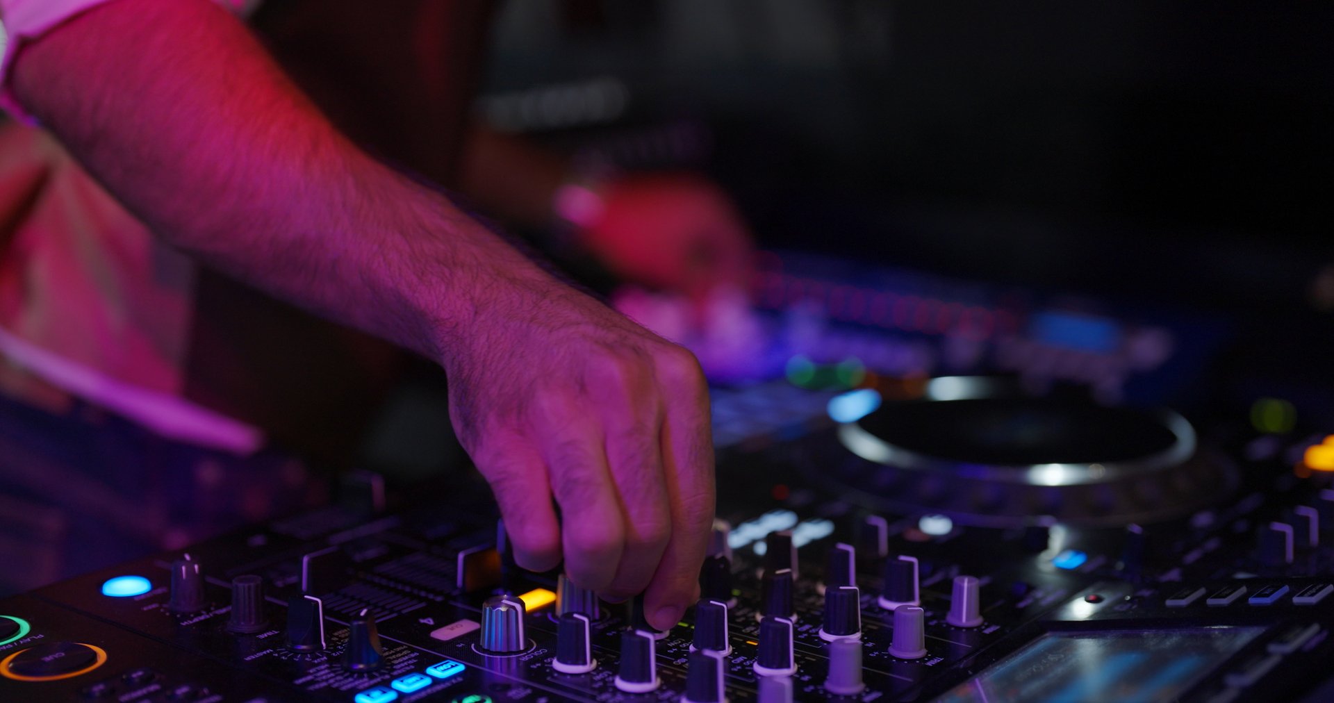 Celebration concept. Close up of a Dj was remix music in pub.