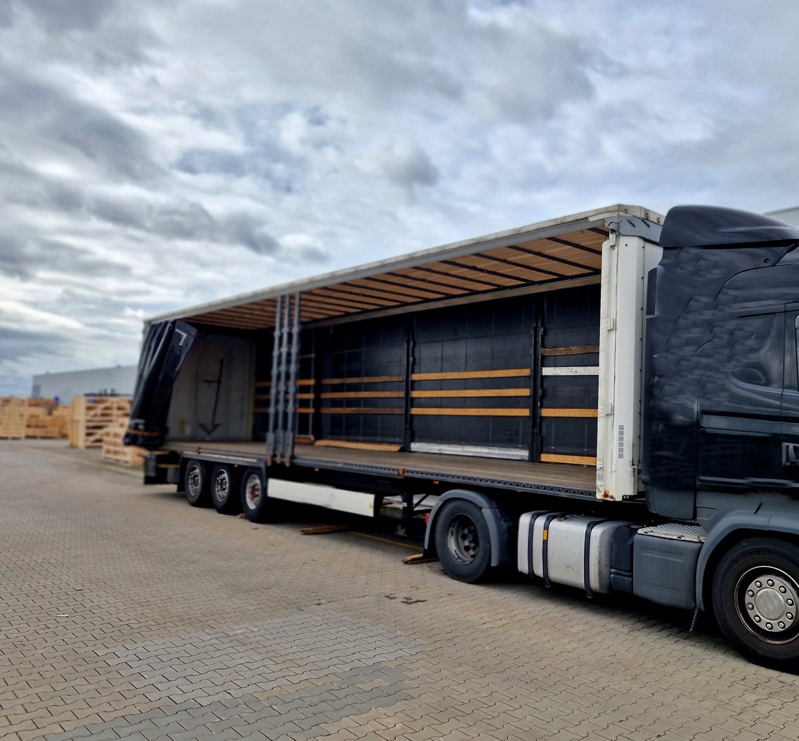 customs control of a van or truck. the car's tarpaulins are raised and suspicious cargo boxes are visible on the pallet. Search for refugees in the body of the truck.