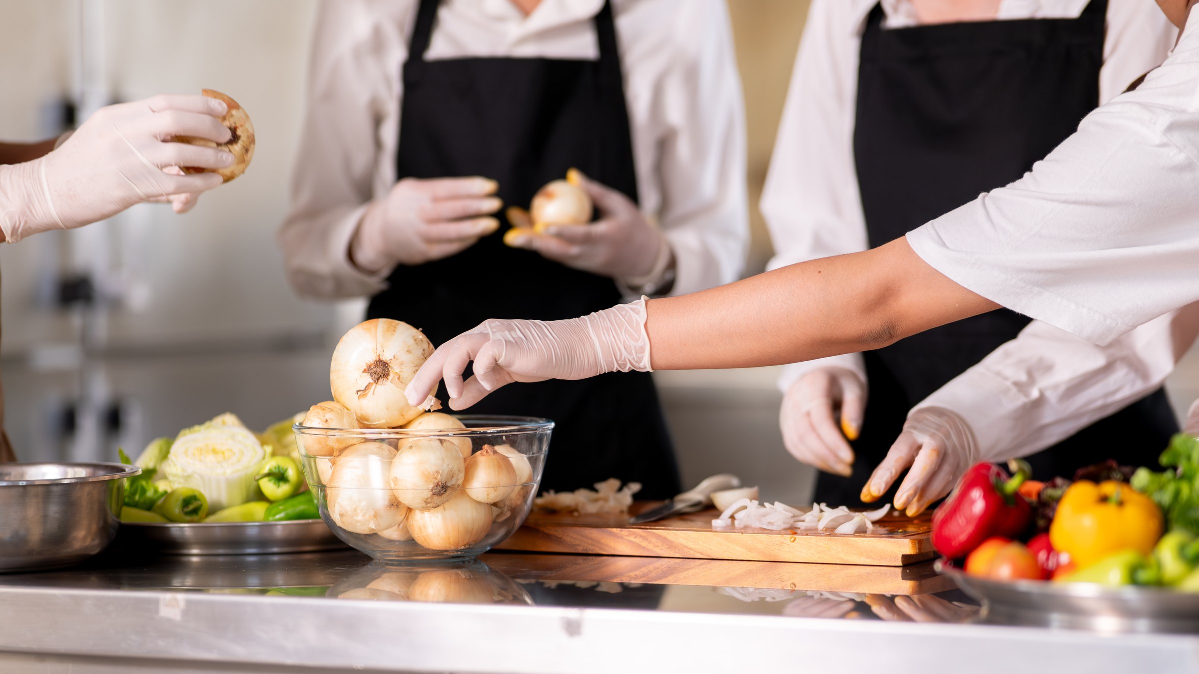 Chef teaching students cooking class