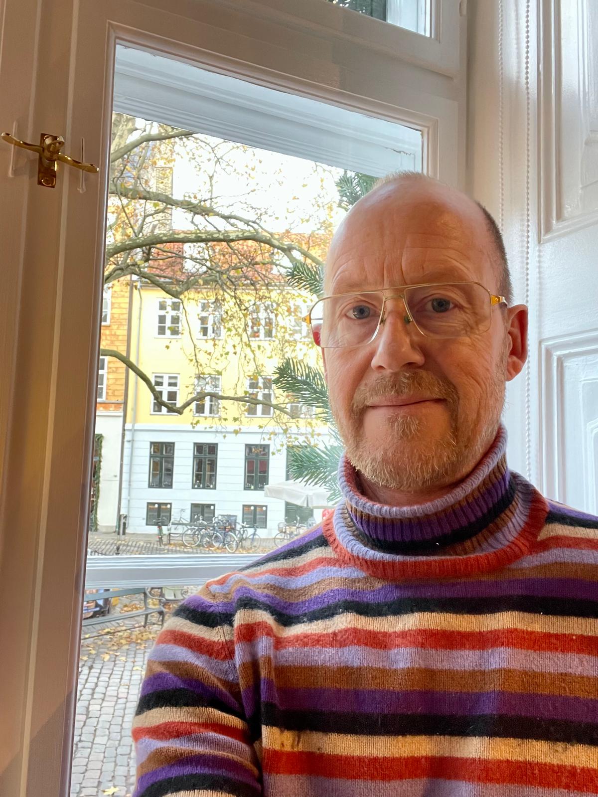 Gorgeous woman with shiny wavy hair on brown background, space for text. Professional hairstyling