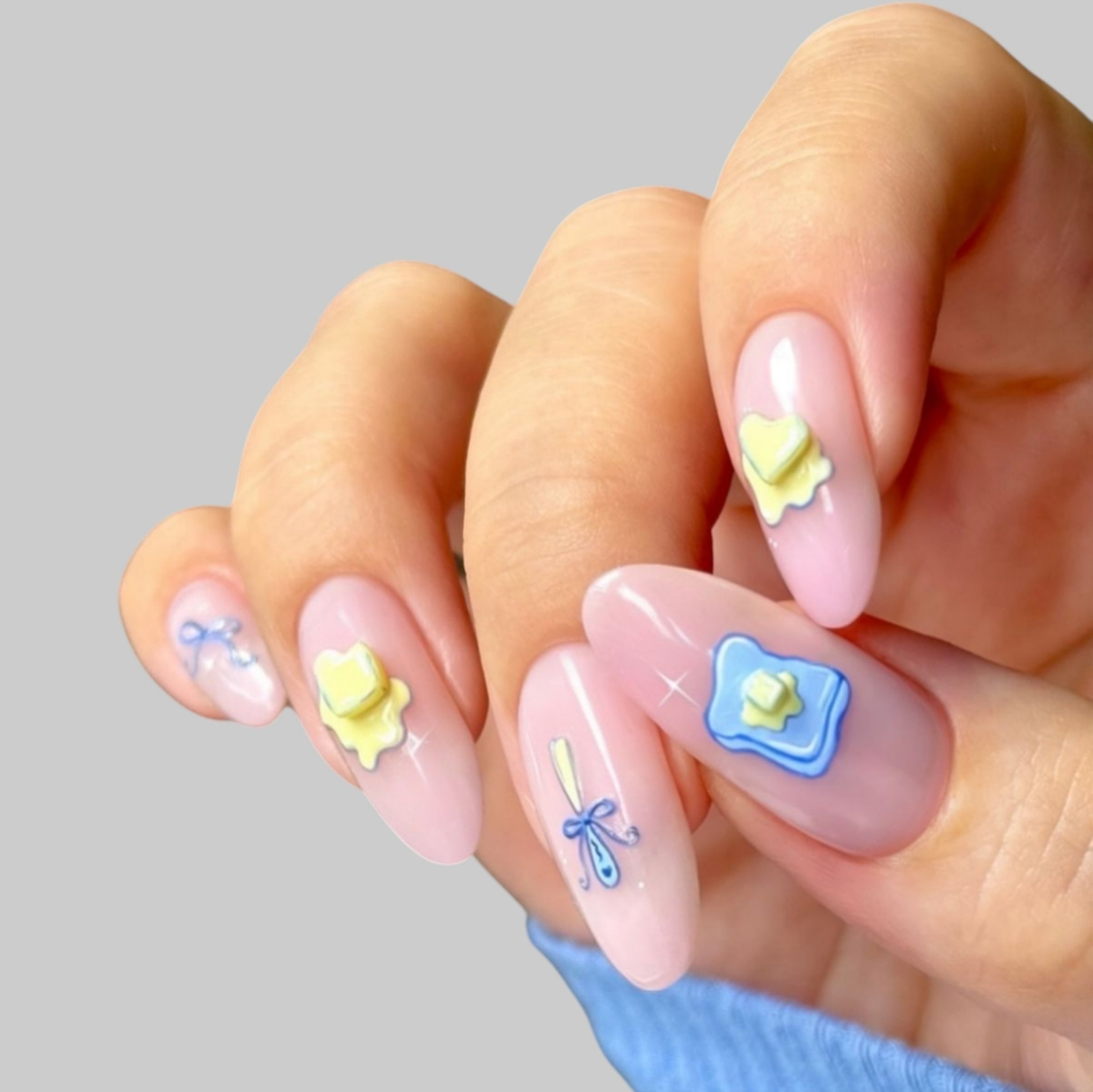 Close-up of a young woman's hand with a trendy, modern manicure. Natural-looking, smooth skin enhances the elegant nail design.