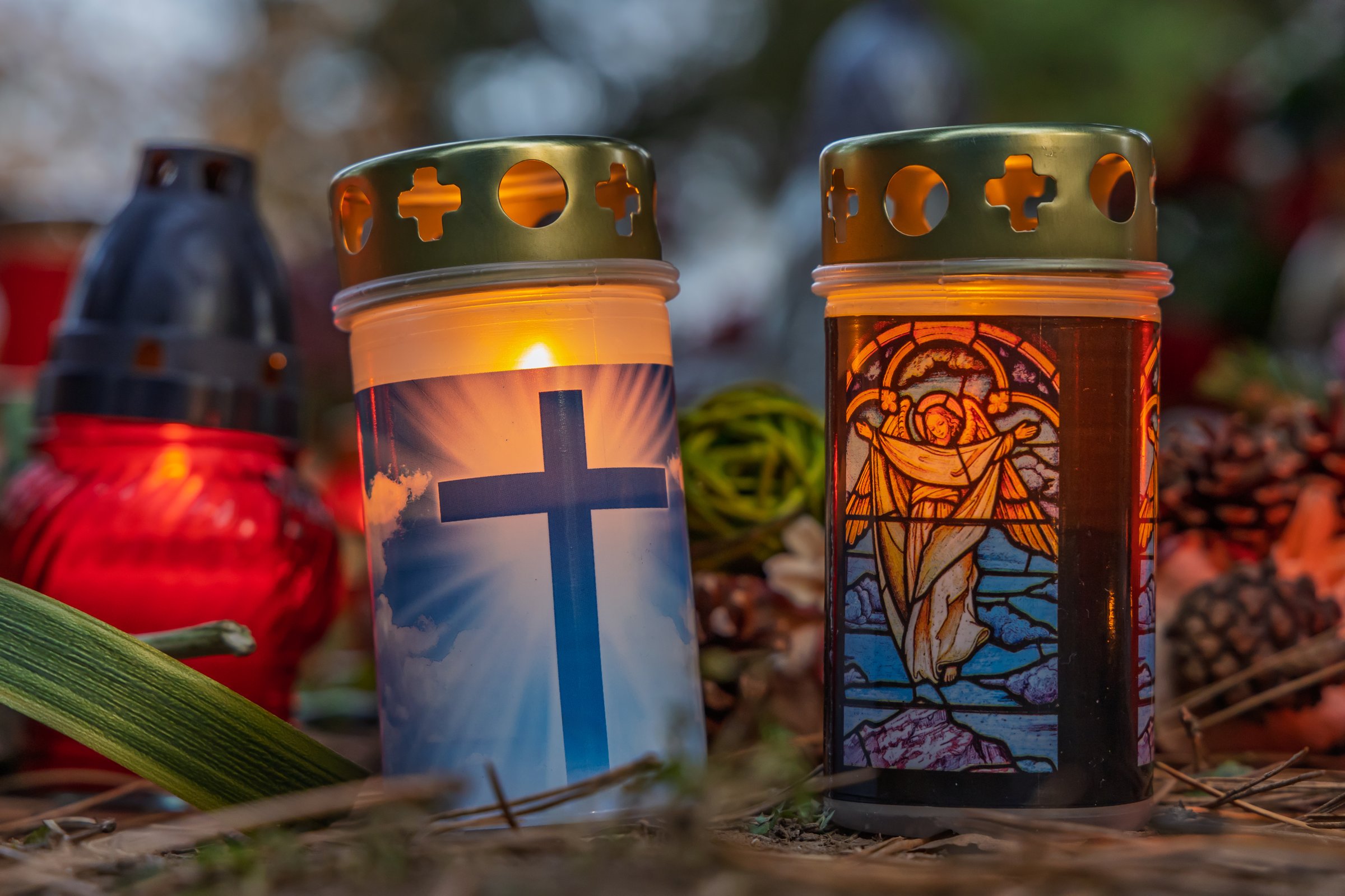 Brno, Czech Republic, November 2, 2024 Lit candles, final resting place in the cemetery. Memorial to the deceased