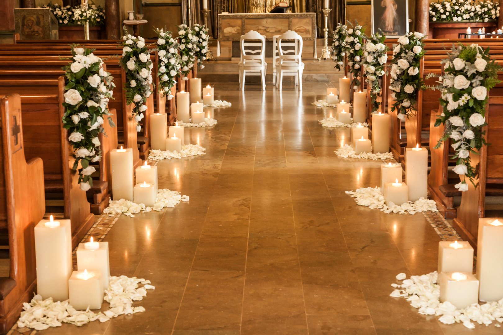 Medellin, Antioquia / Colombia; May 23, 2019: Catholic temple decorated with flowers and candles for wedding.