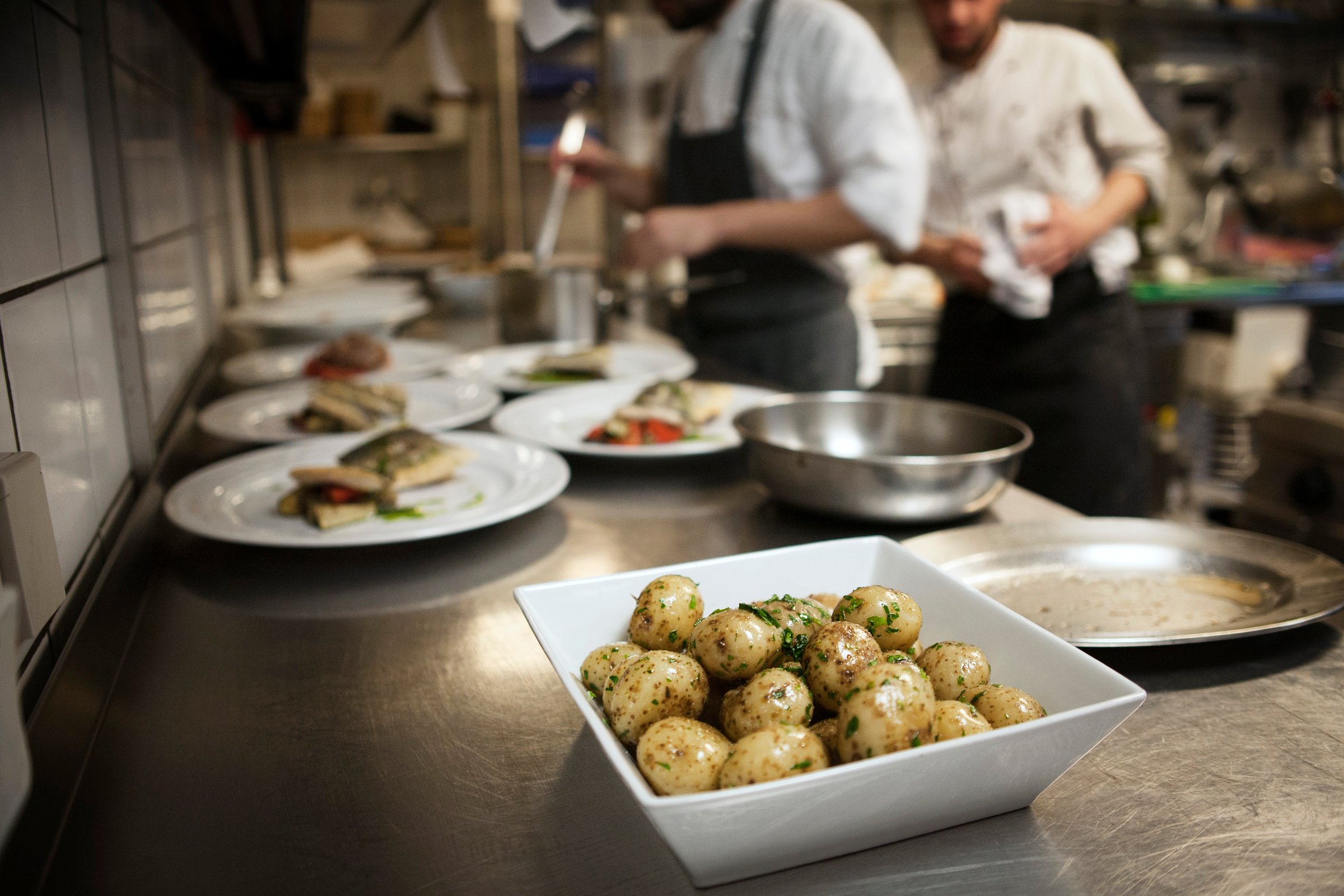 Prepared Potatoes In Bowl On Counter In Commercial Kitchen
