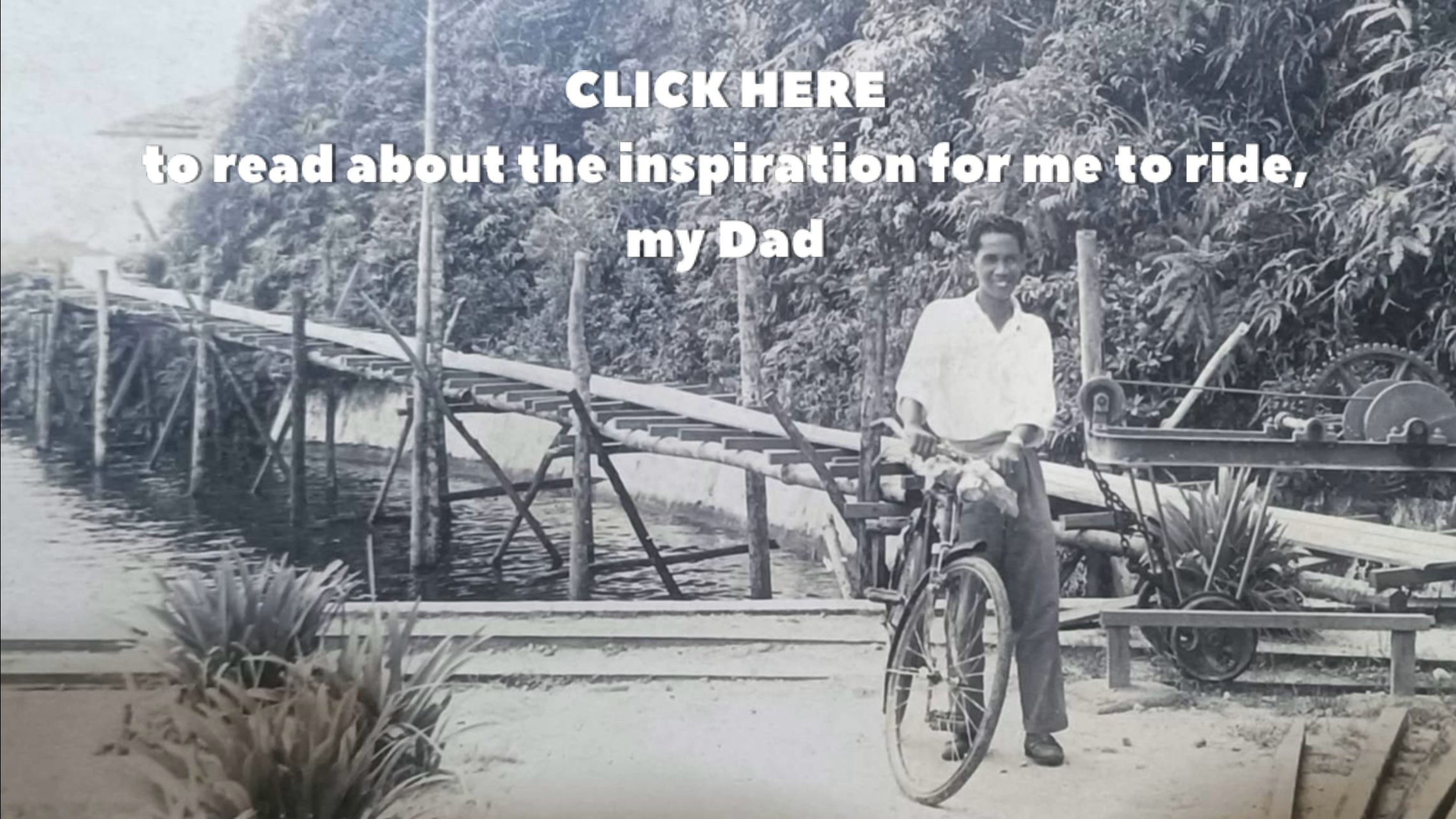 Man stands with a bicycle on a wooden bridge background with text about reading an inspiration story about his dad.