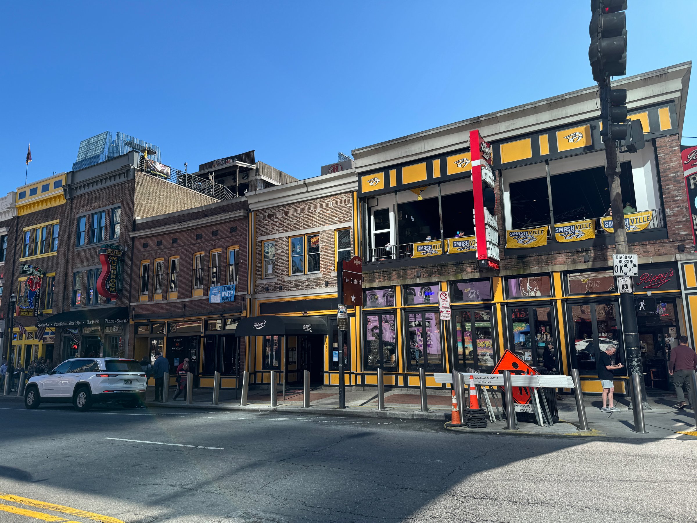 Nashville TN USA November 16 2024: The lively street showcases colorful buildings filled with local shops and restaurants, attracting visitors and locals alike enjoying the vibrant atmosphere.