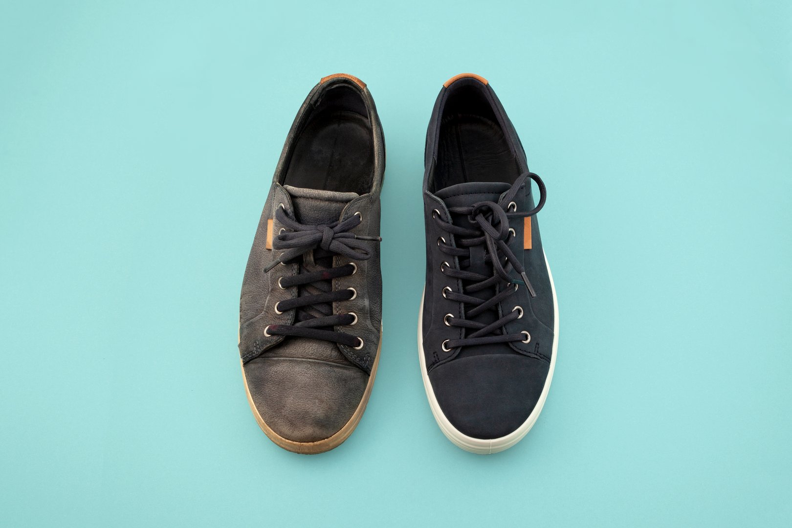 One used dirty and one new sneaker. Striking contrast between two conditions of same shoe. Design element for Shoe Repair Shop. Cleaning concept, Before and After. Removing Scuff Marks and Stains.