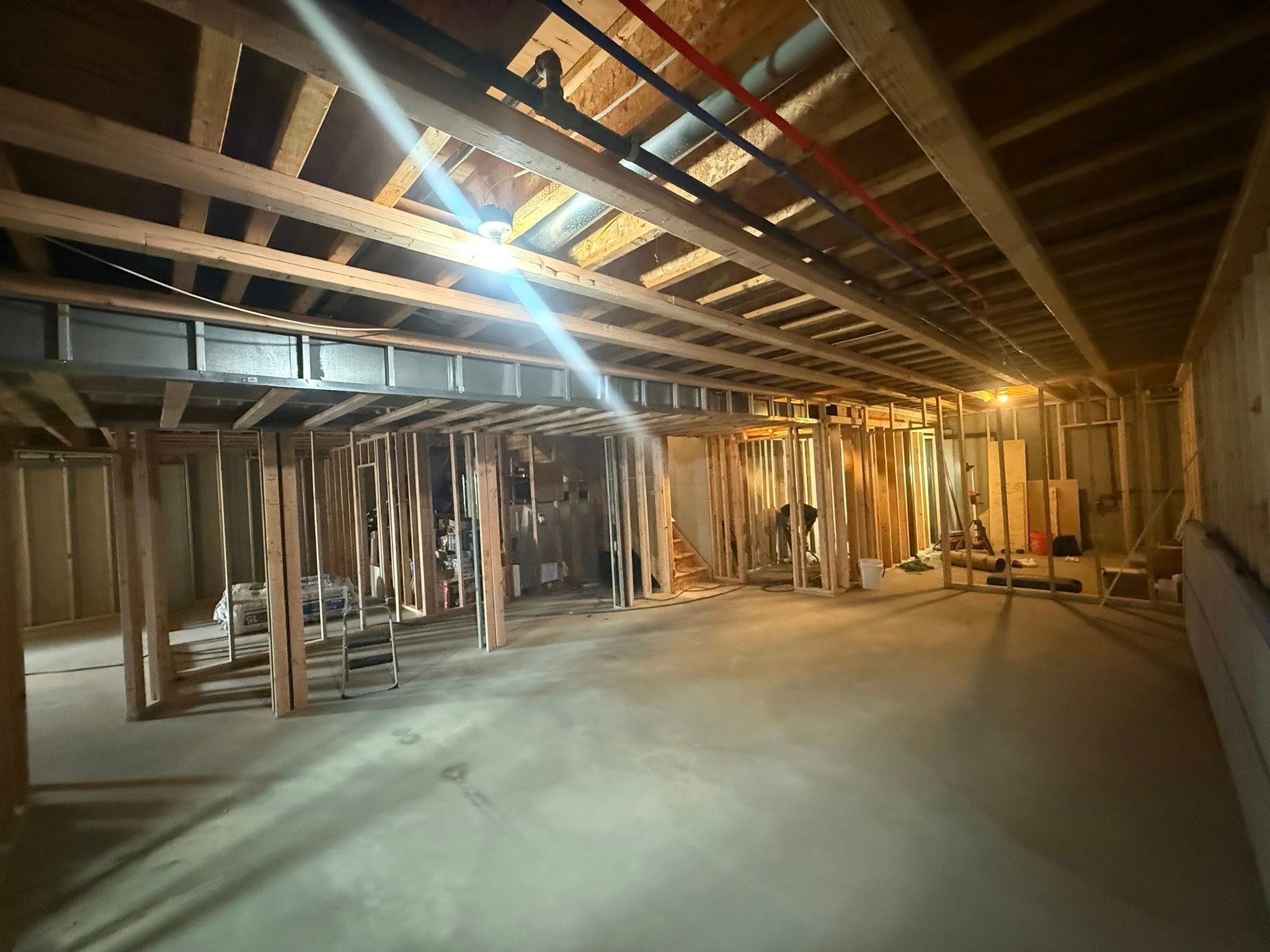 Custom basement entertainment area with bar