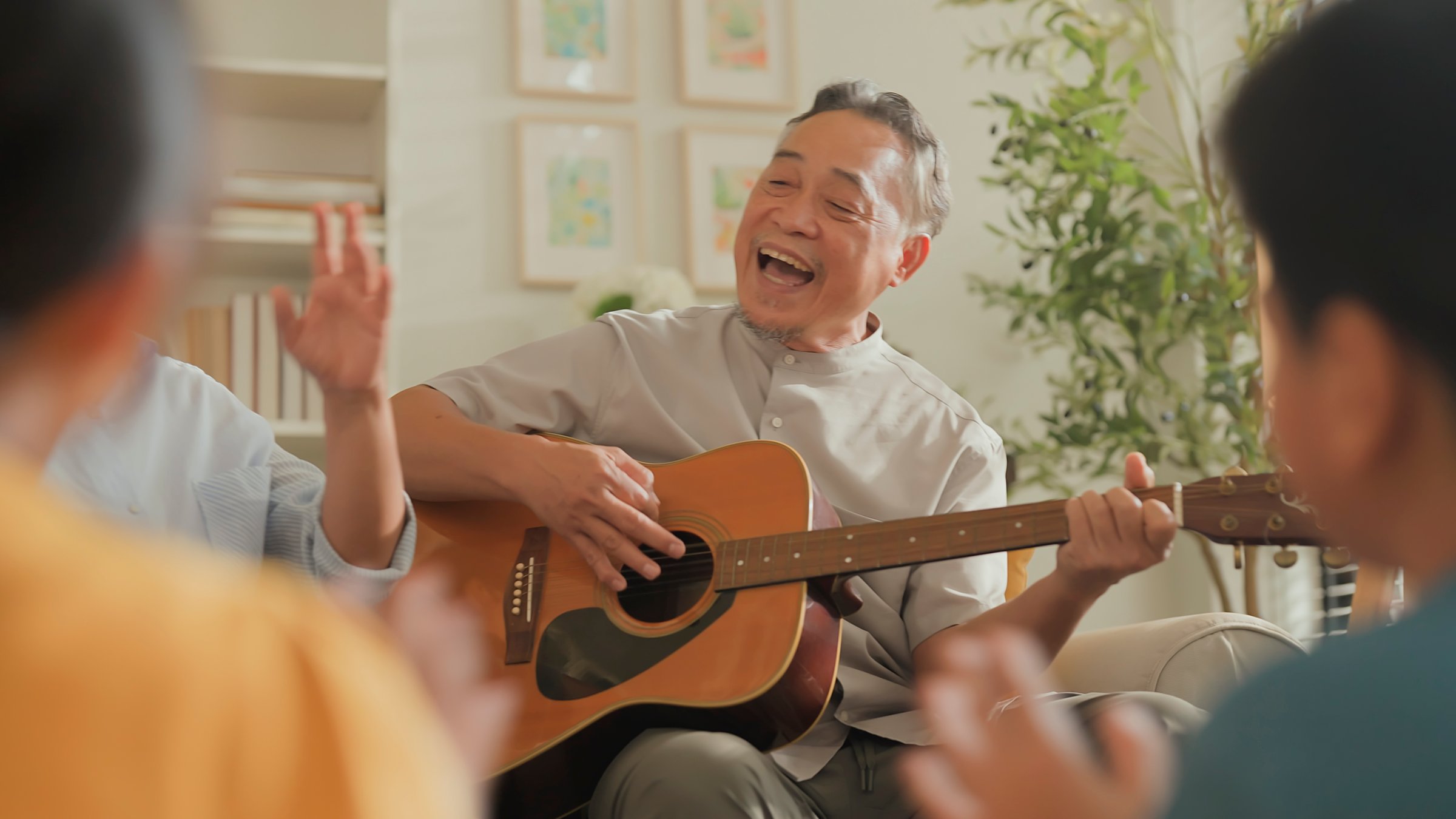 Family playing guitar together
