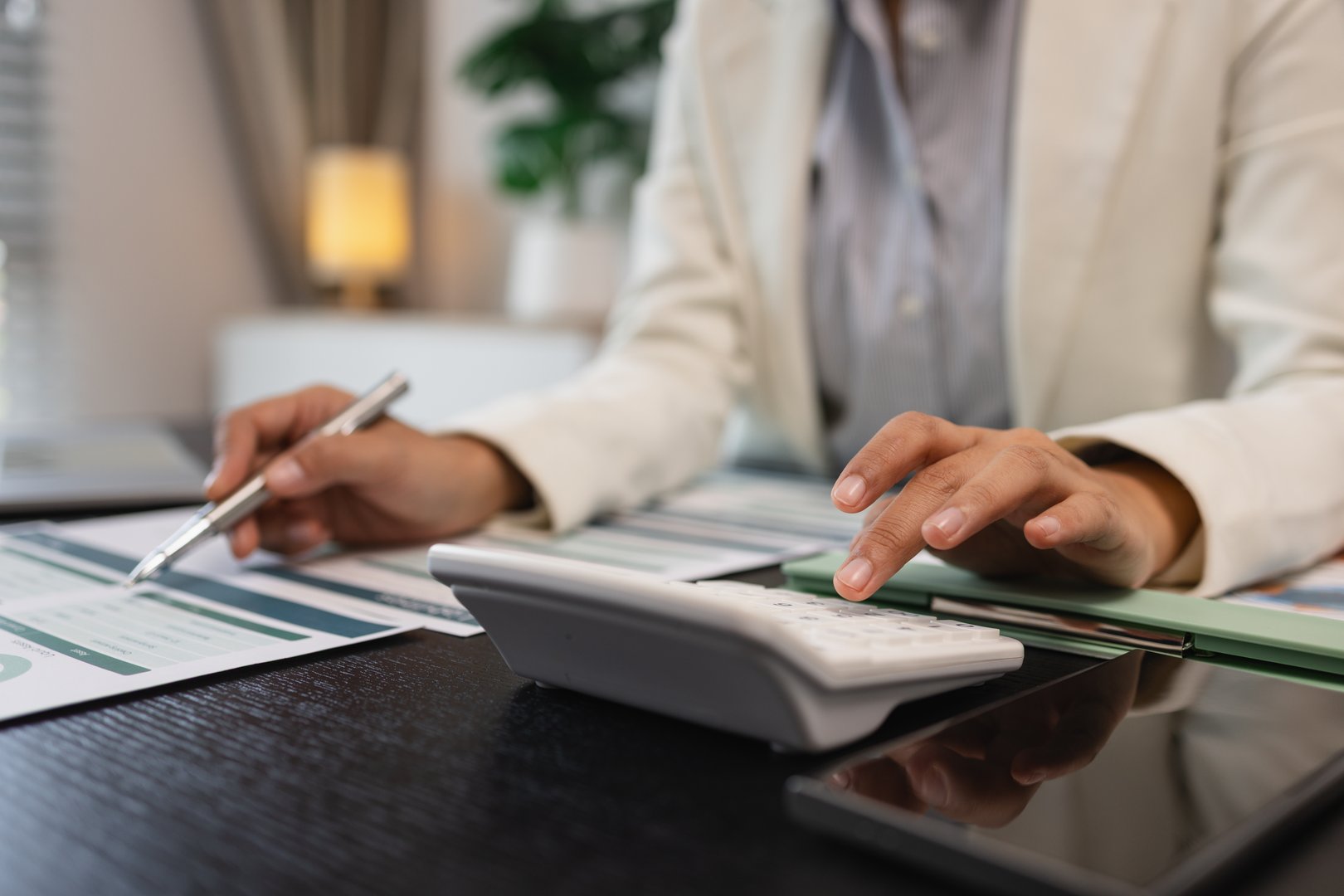 working in the office with a lot of paper work, businessman is checking marketing data, e an employee is working with finance document, sitting in the office working for accountant company