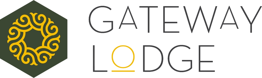 Hexagonal emblem with yellow swirl beside the text Gateway Lodge, featuring a stylized O in yellow.
