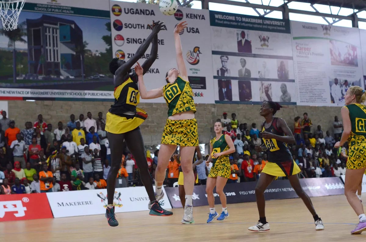 Realistic netball team in competitive action