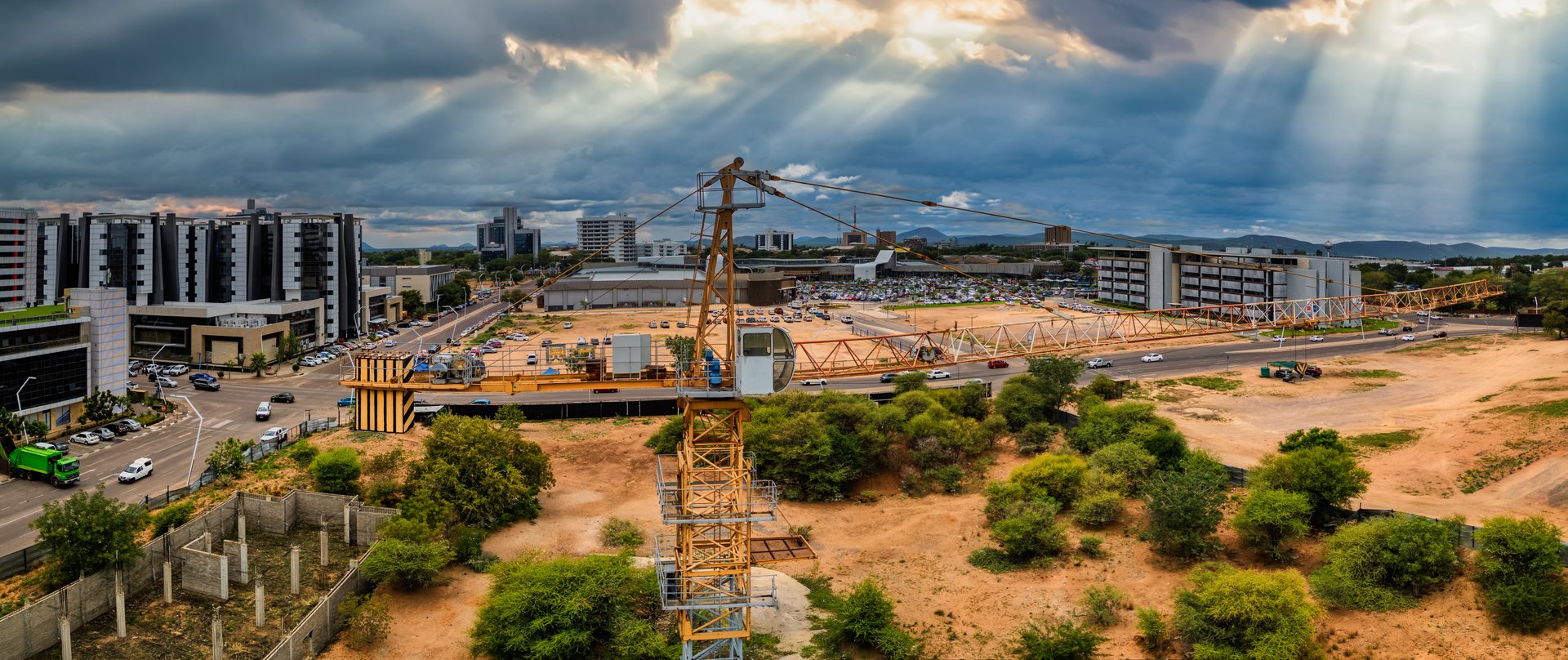 Gaborone, Botswana, aerial view, capital city, panorama of the central business district and shopping mall, crane in the foreground