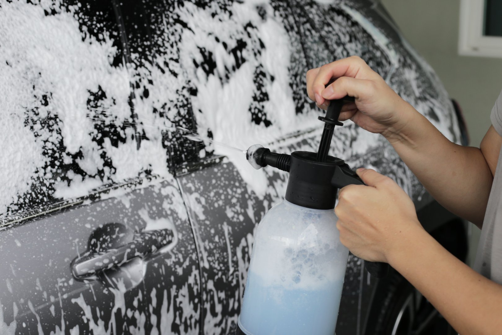 Car with white soap foam pre-wash