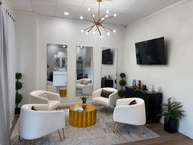 GLO Aesthetics & Wellness Lounge lobby with elegant decor and seating