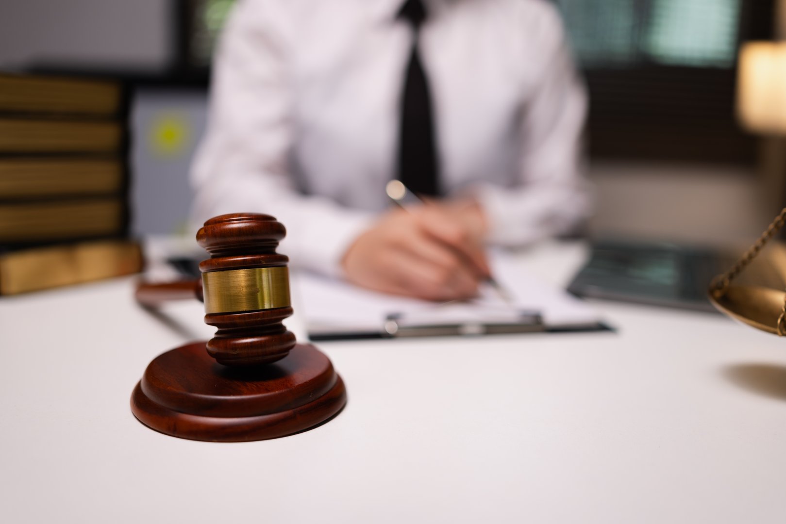 Lawyer businesswoman working diligently with signature document in a modern office, Signing contract, Justice and lawyer concept.