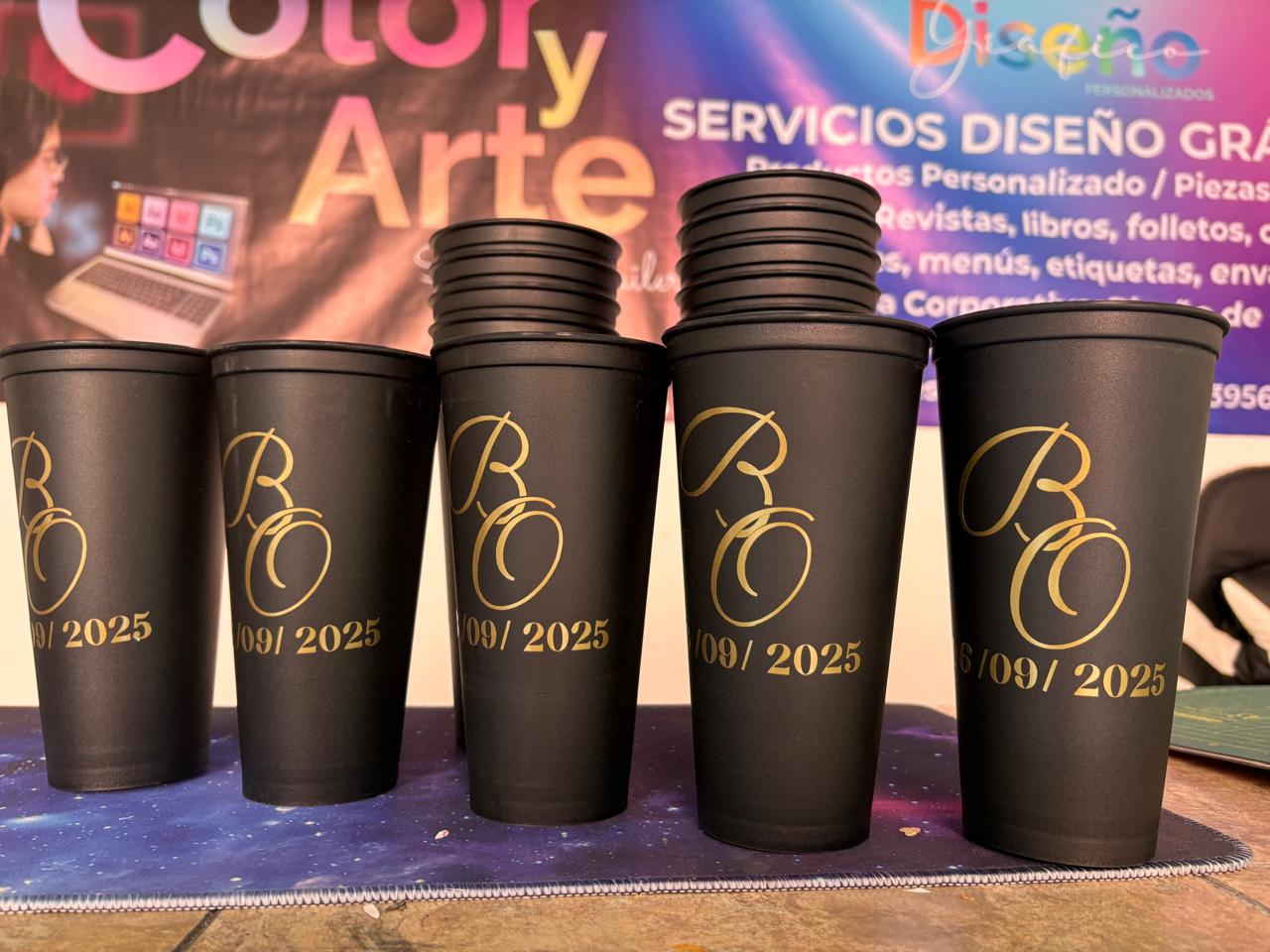 t-shirt in a male hands ready for printing. creating print on t-shirt in workshop. serigraphy production