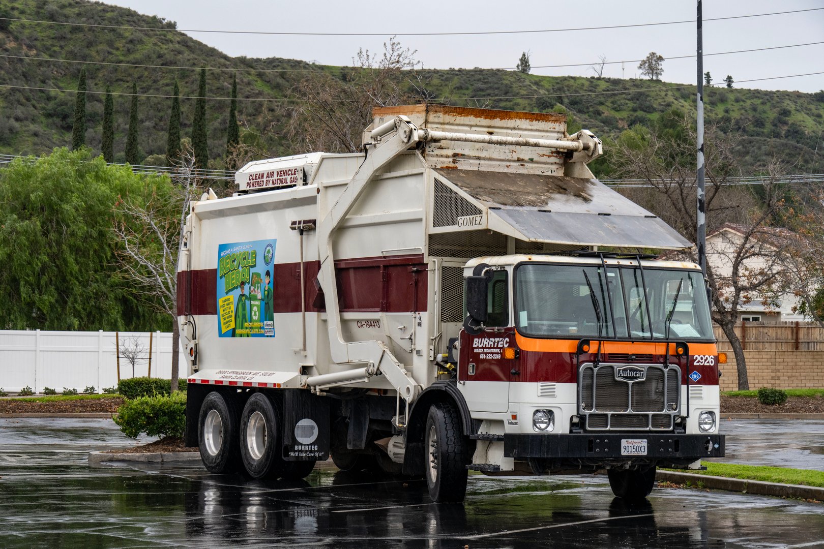 Santa Clarita, California- A front loader trash truck parked in this shopping center parking lot