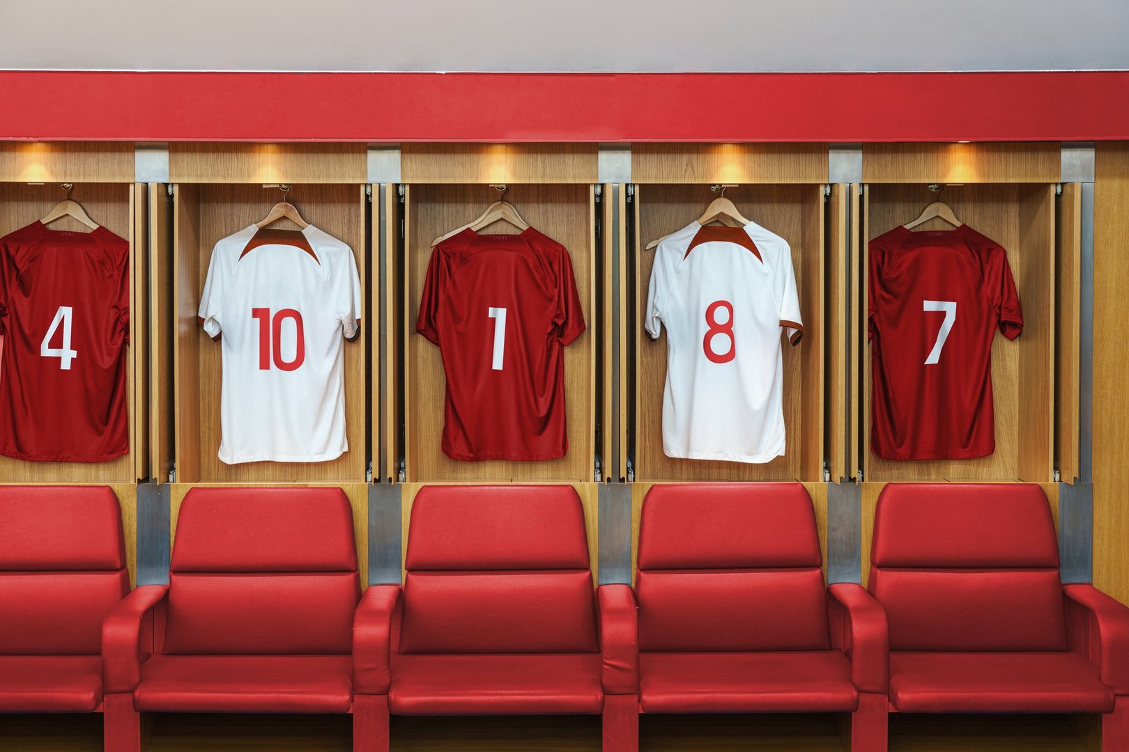 Consist of several photos and photo elements. Football changing room in a large stadium with different players' jerseys