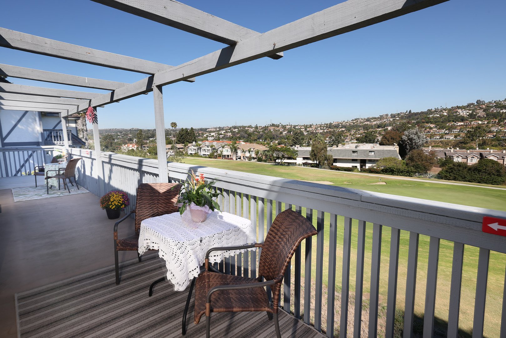 Coastal Comforts patio with golf course views