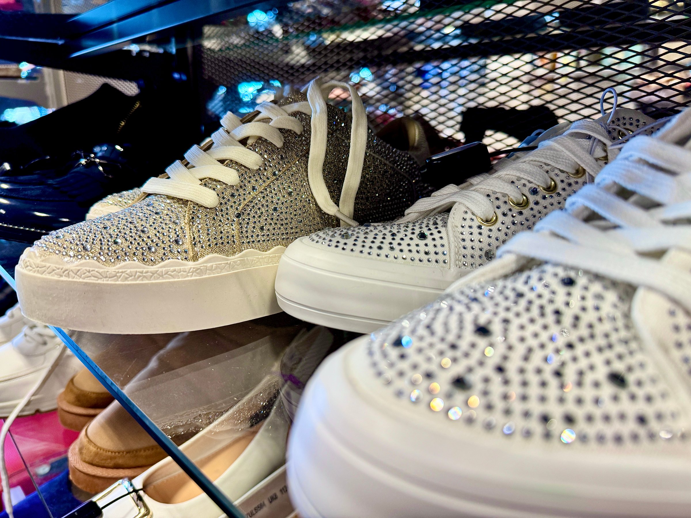New footwear featuring sequins on a retail shelf for sale